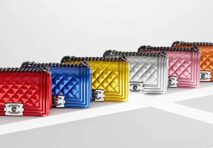 Chanel Boy bags shown in pink, black, and blue